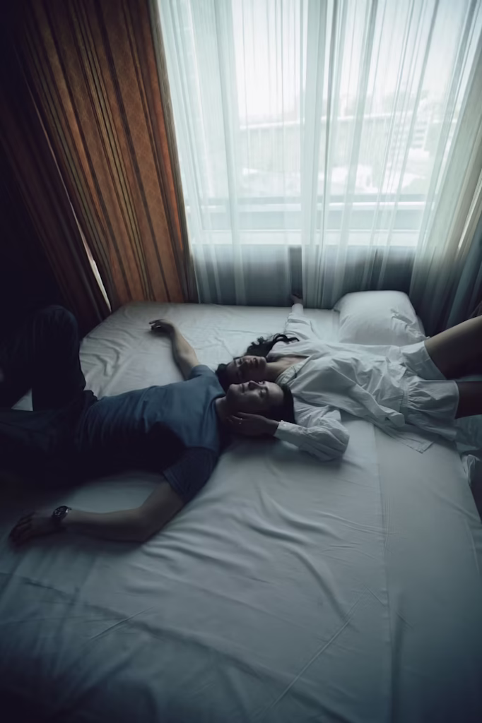 Men and women on a bed